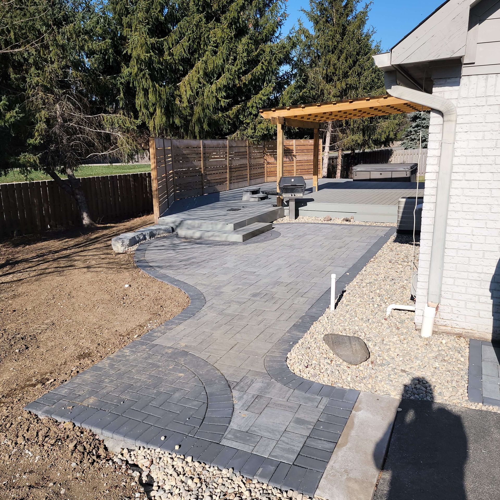 newly installed grey brick patio in indianapolis backyard