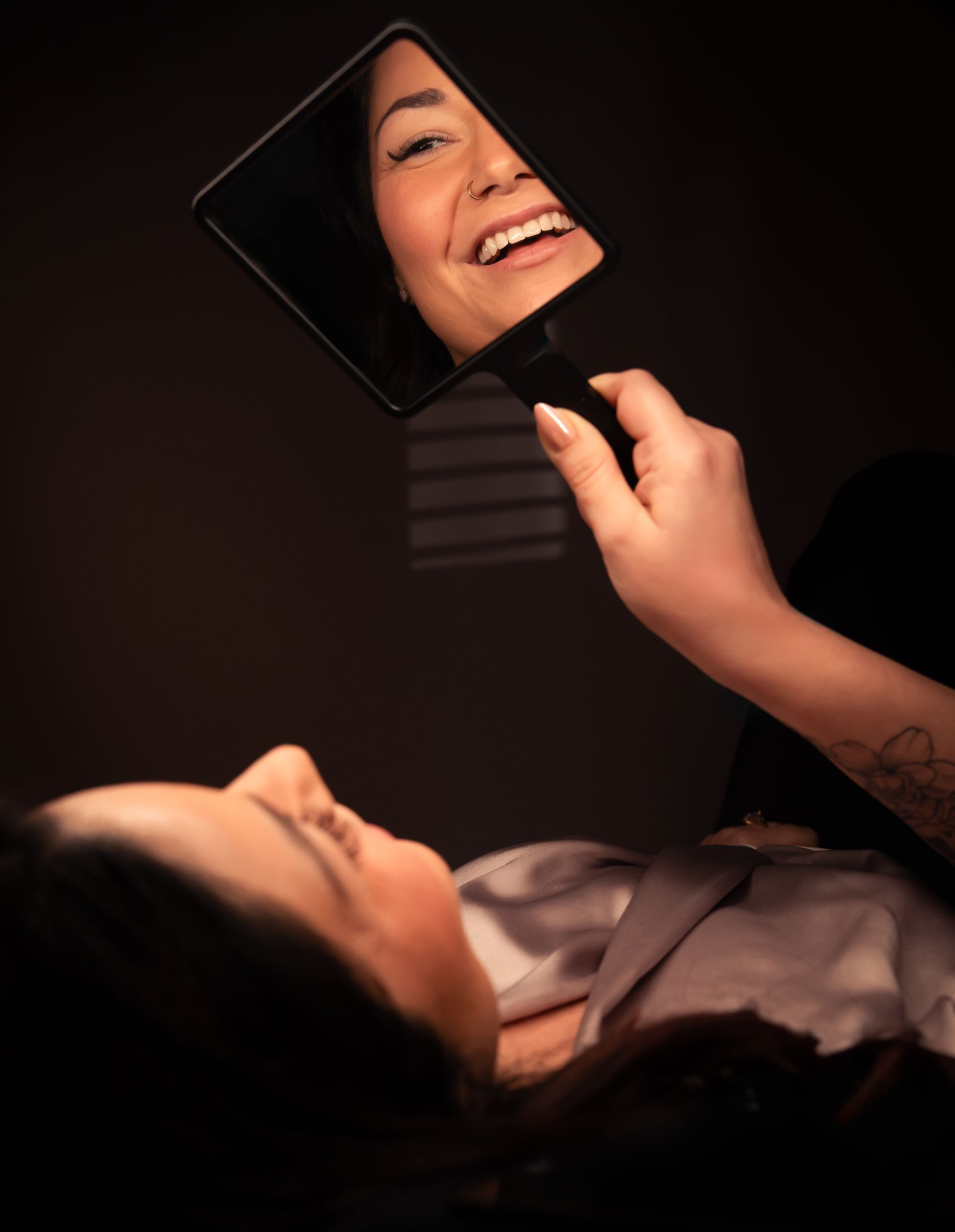 A close up of a woman 's eye with long eyelashes.