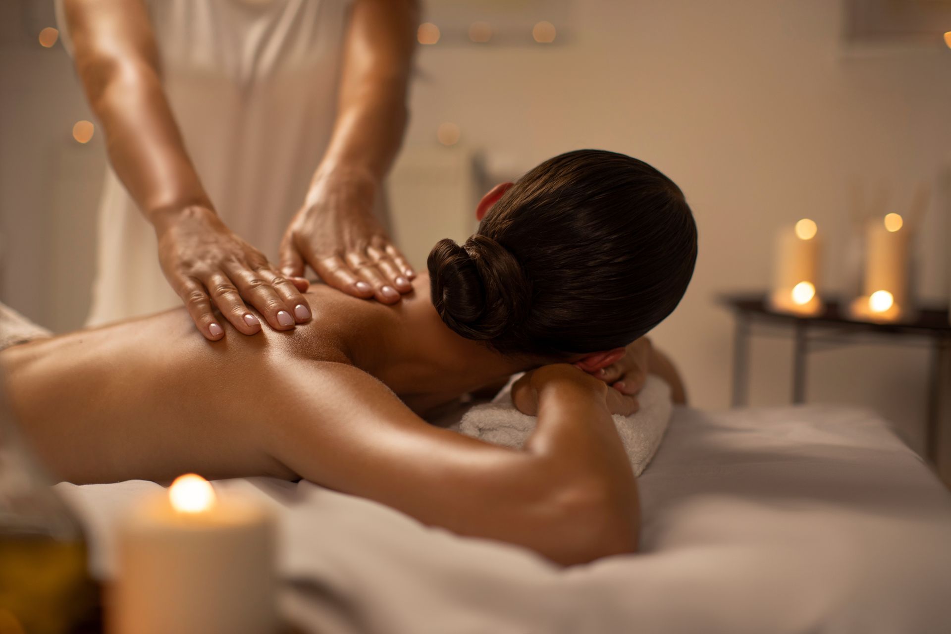 A woman is getting a massage at a spa.