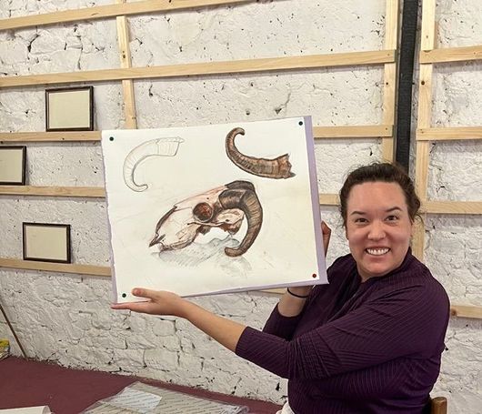 A drawing of a house with a bench in front of it