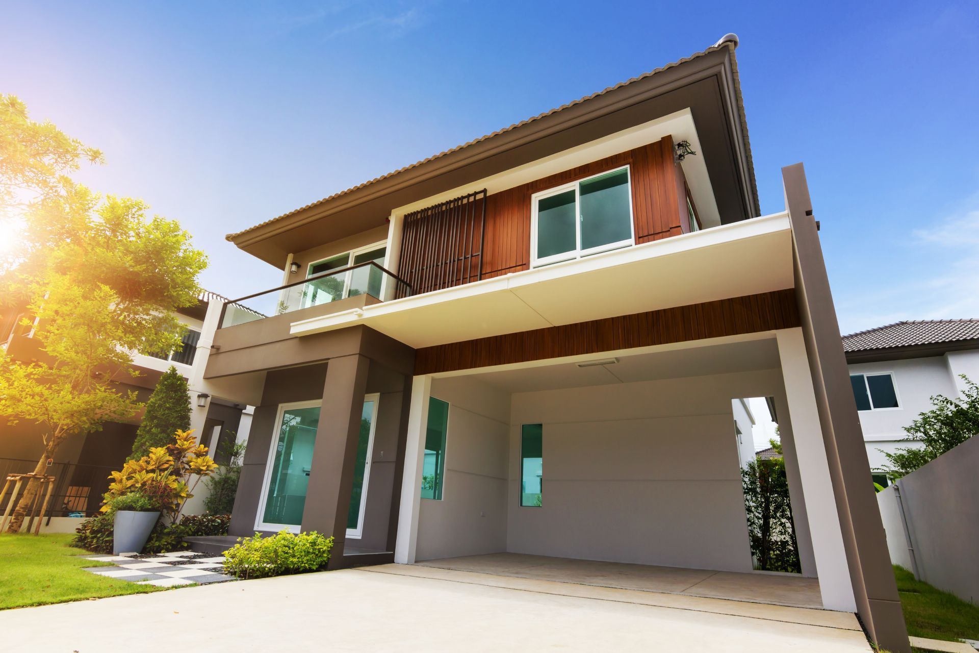 A large house with a garage and a balcony