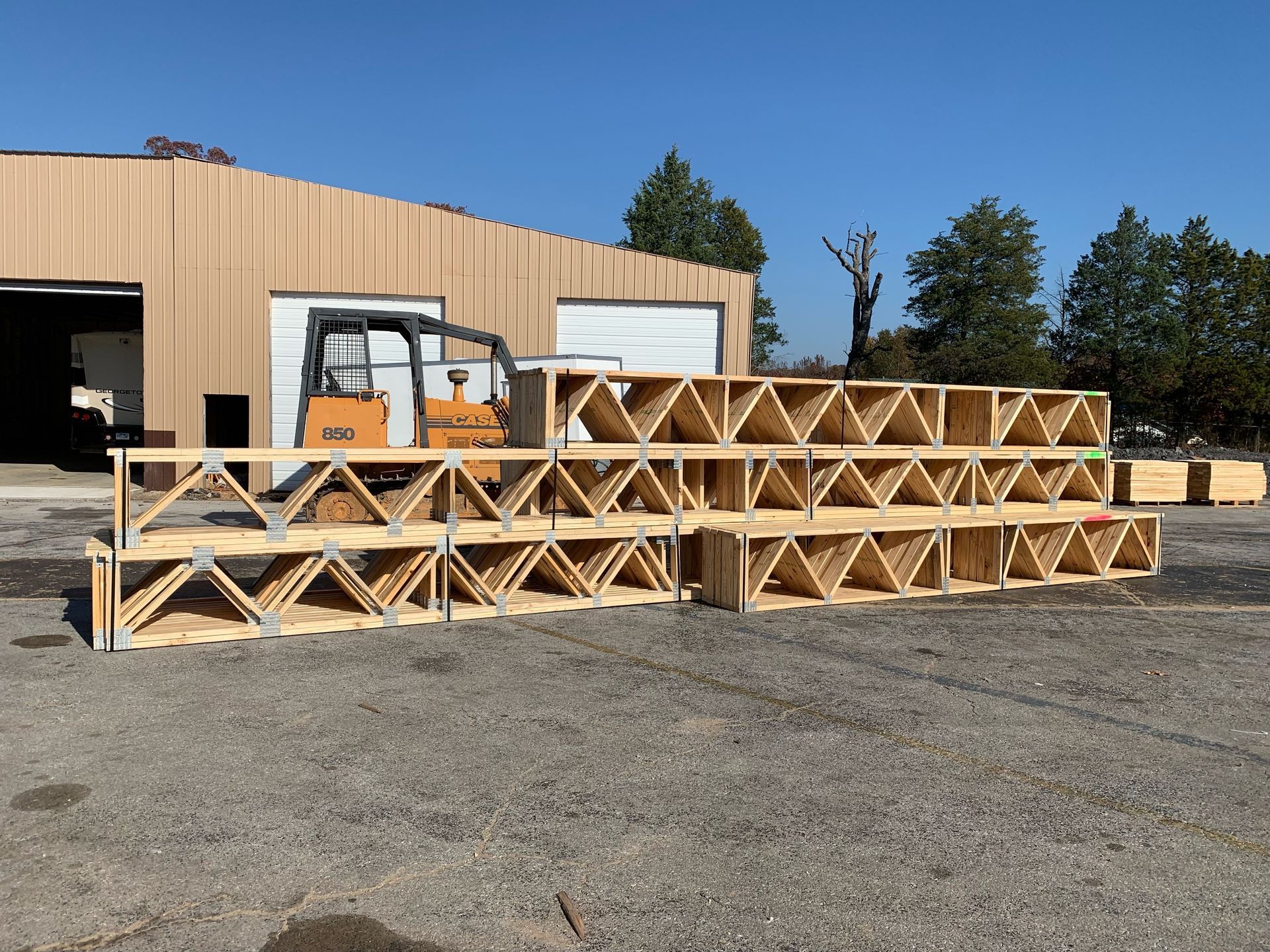 a case 580 forklift is parked in front of a building