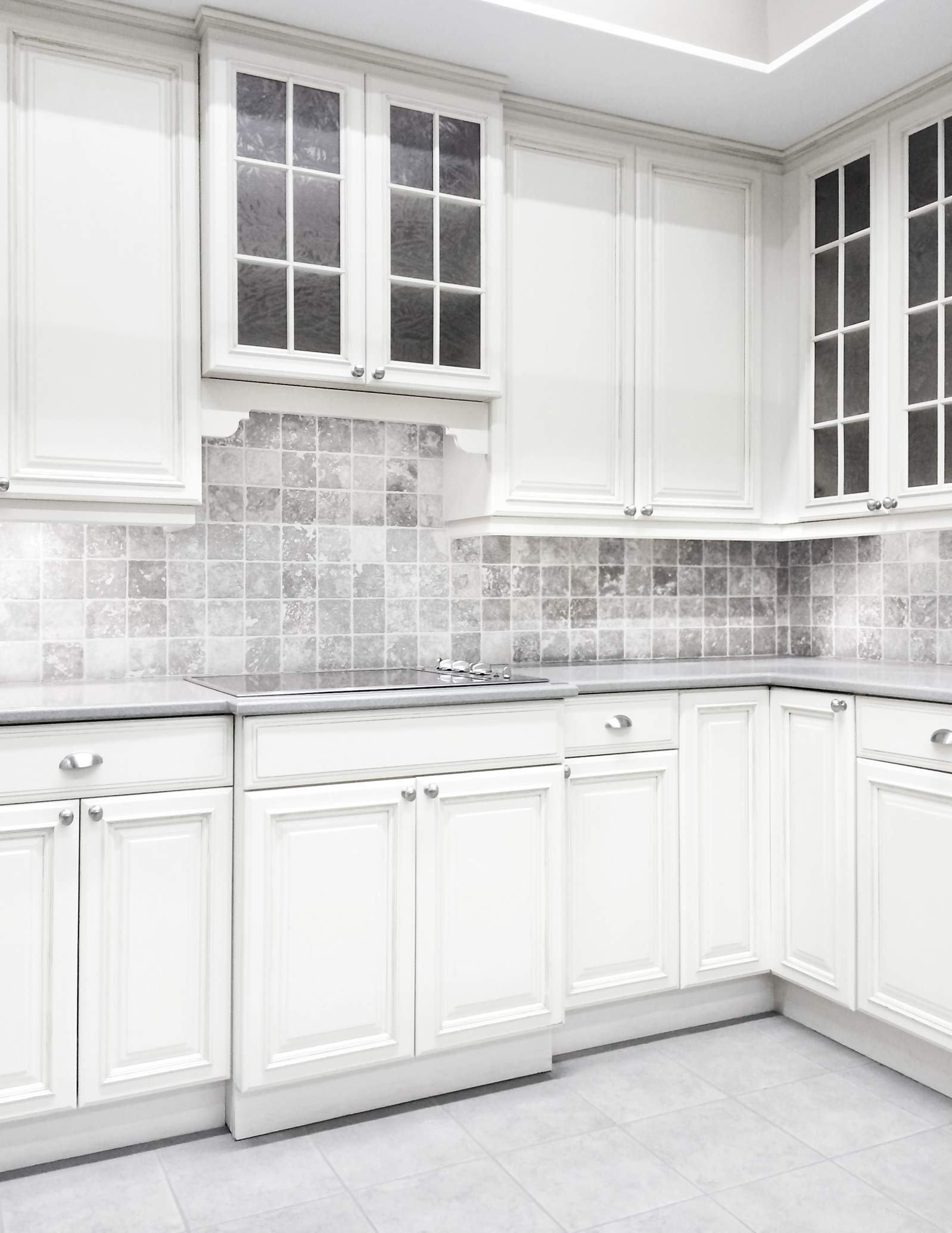 White Kitchen — Kitchen with White Cabinets and Tiled Walls in Addison, IL