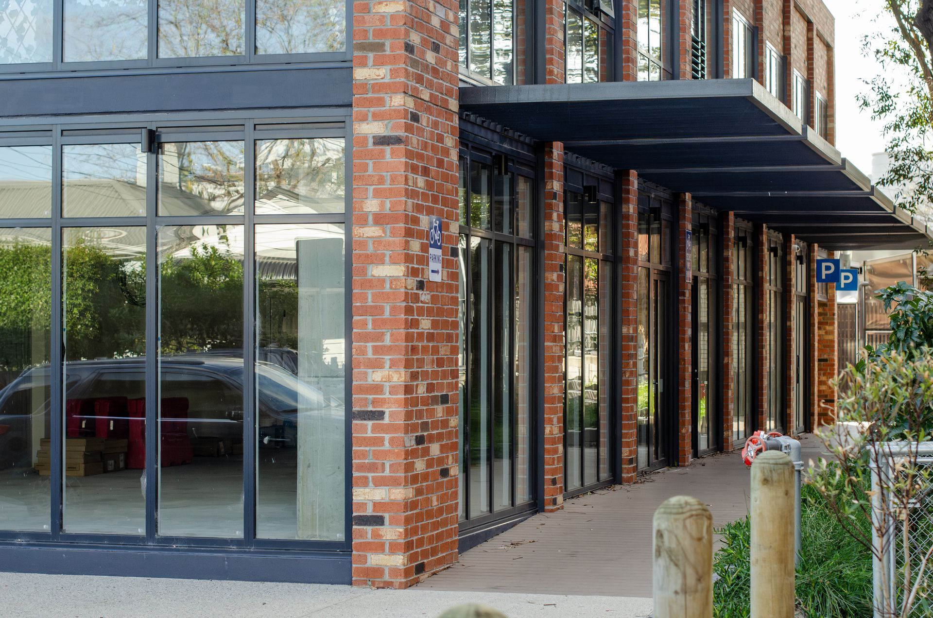 An empty corner retail unit with glass frontage. An empty corner retail unit with glass frontage.