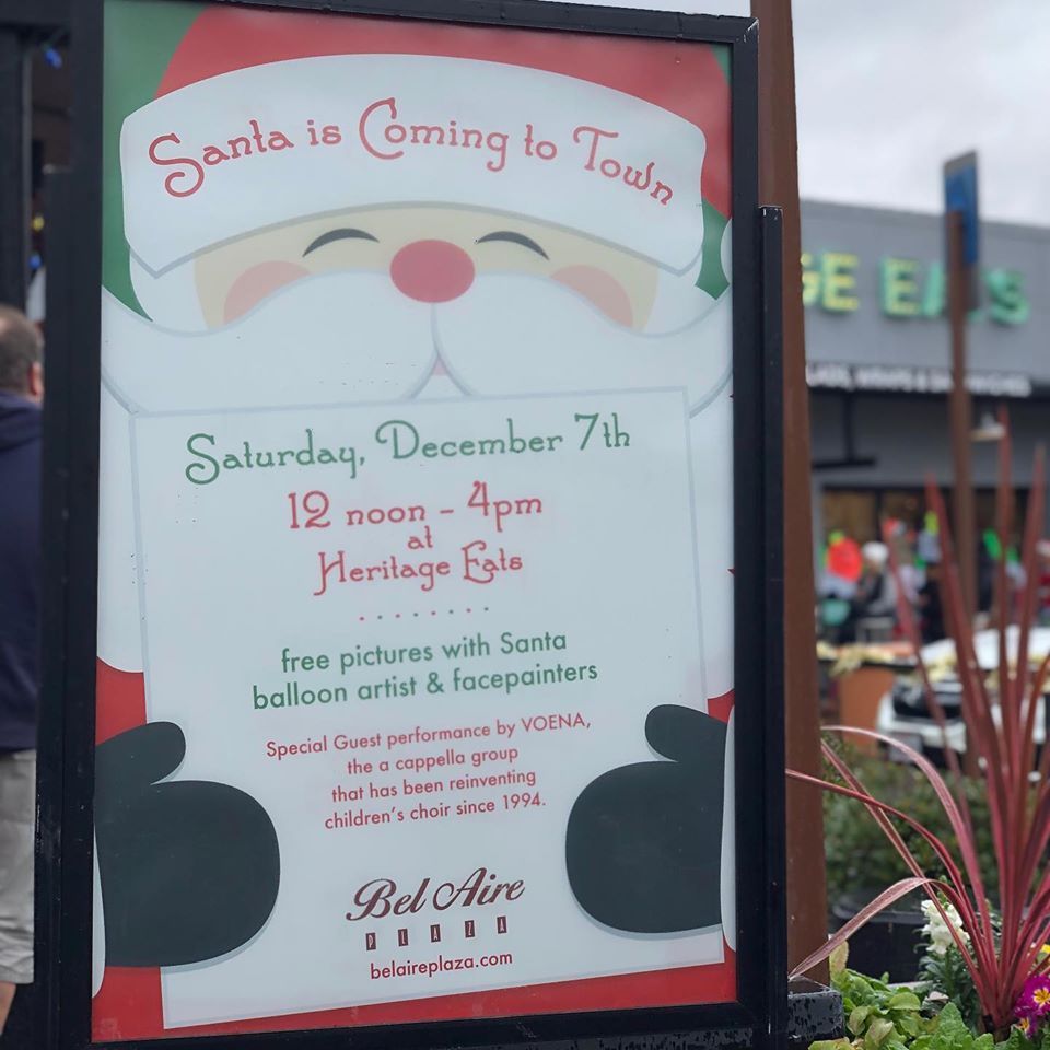 A sign that says santa is coming to town on it