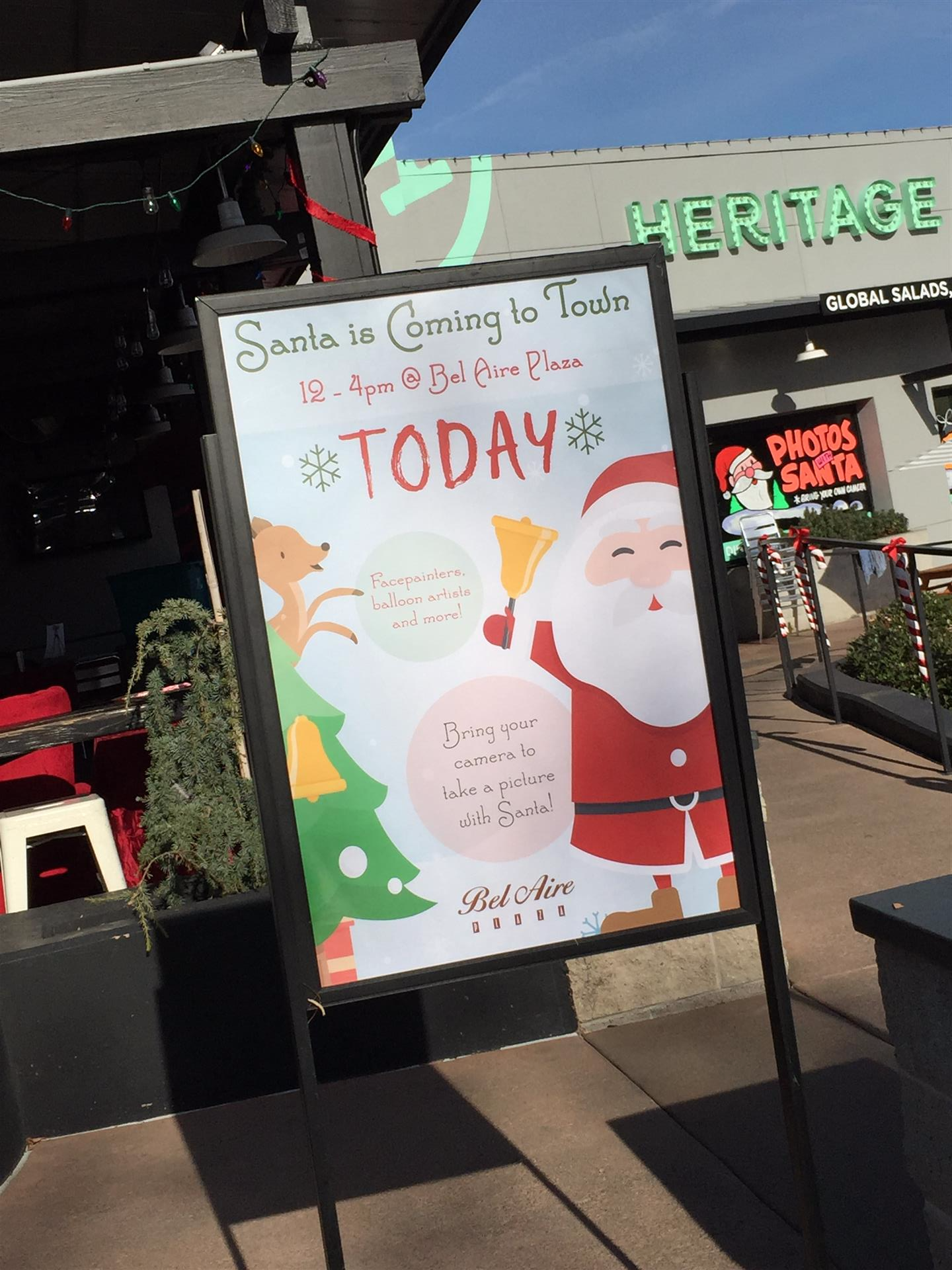 A sign that says santa is coming to town today