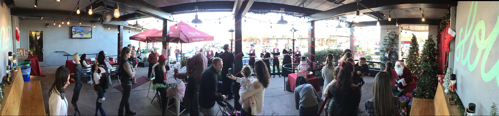 A large group of people are standing in a room.