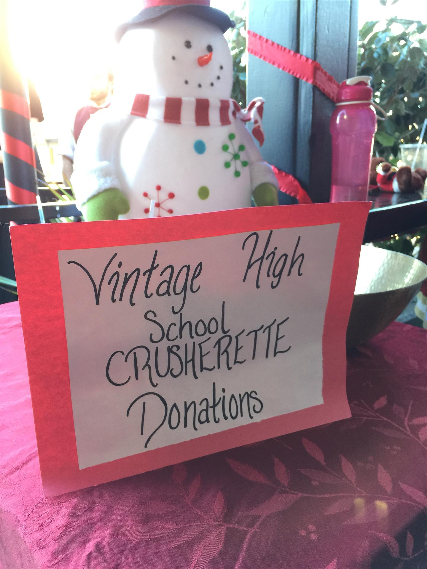 A sign for vintage high school crusherette donations