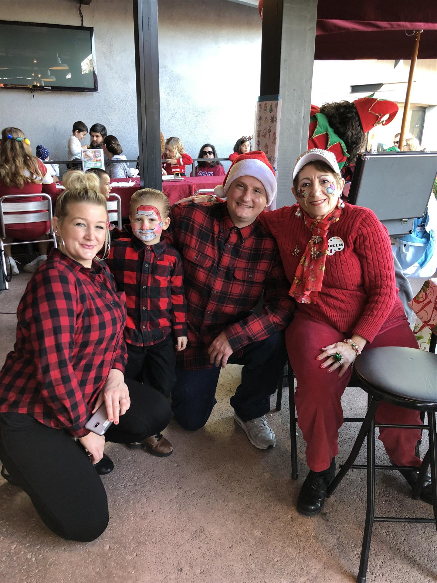 A group of people are posing for a picture in a restaurant.