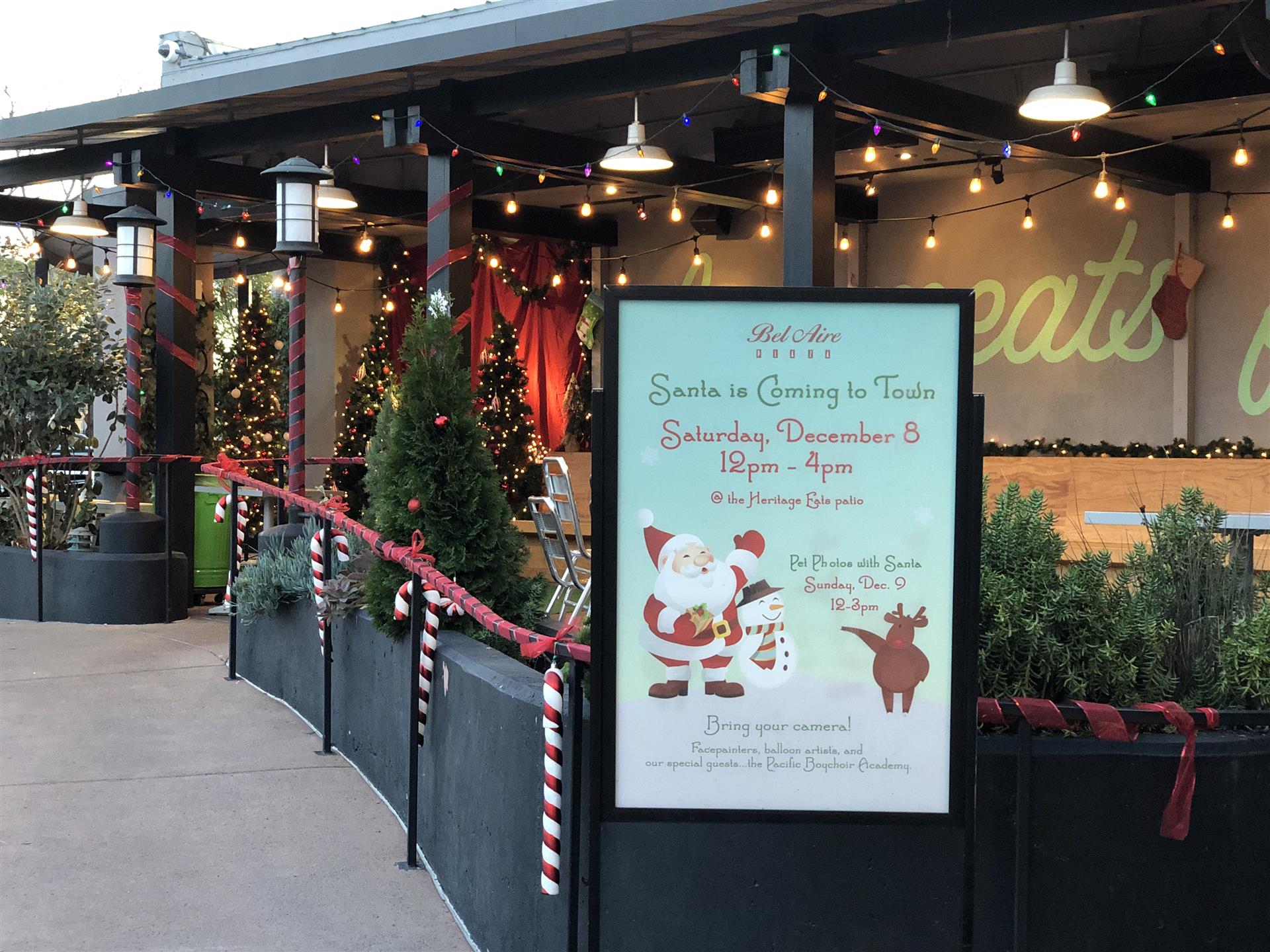 A sign that says santa is coming to town on it