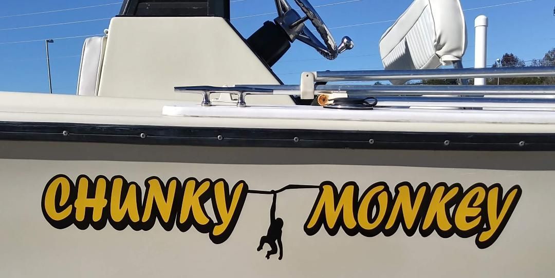 A boat that says chunky monkey on the side