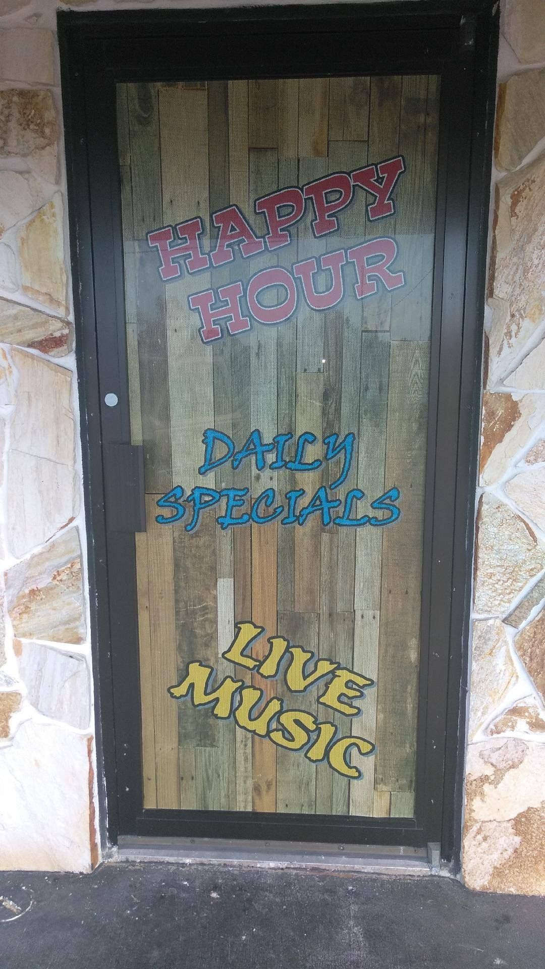 A door with a sign on it that says `` live music ''.
