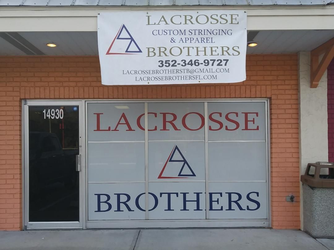 A sign for lacrosse brothers is above the door