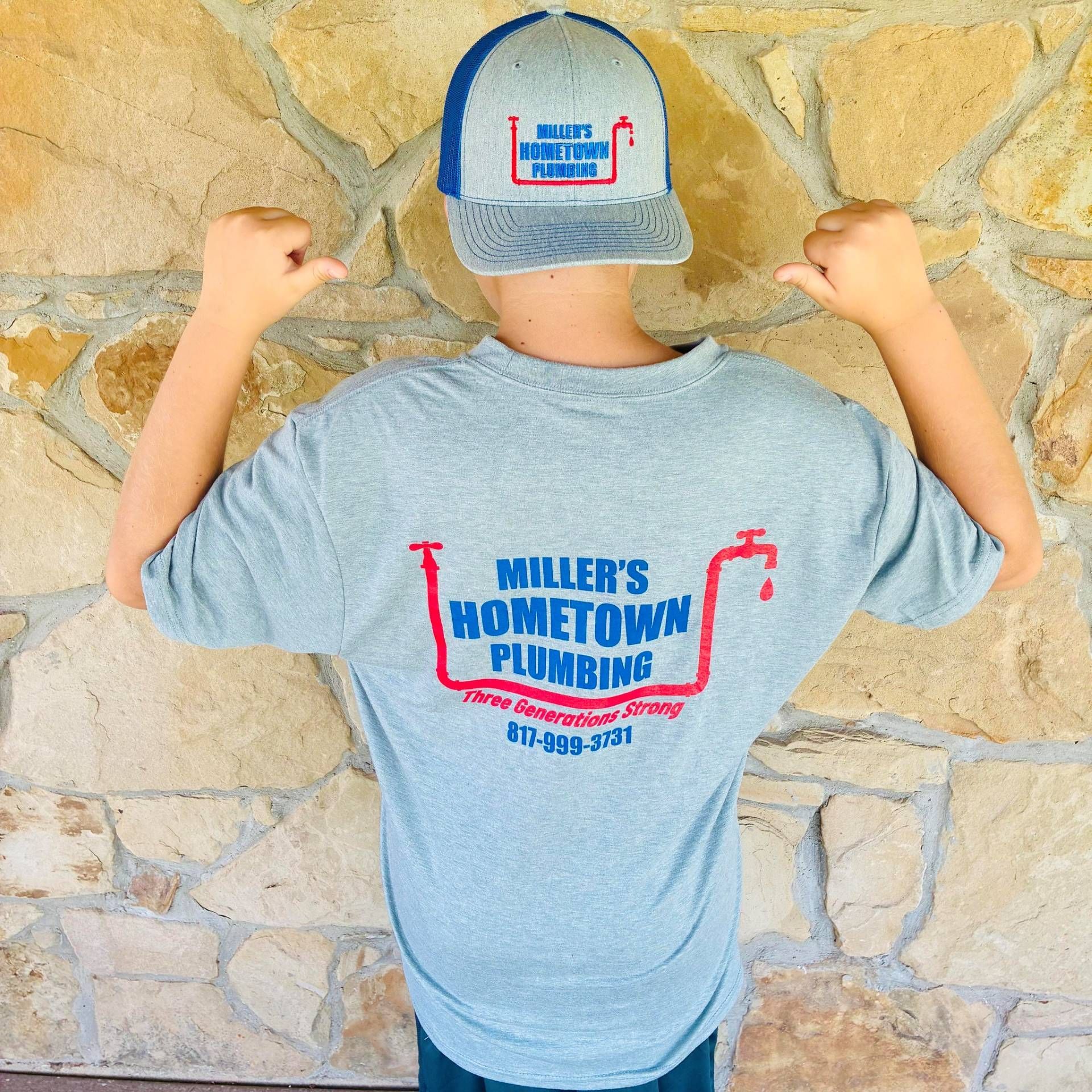 Person wearing a gray t-shirt and hat with 