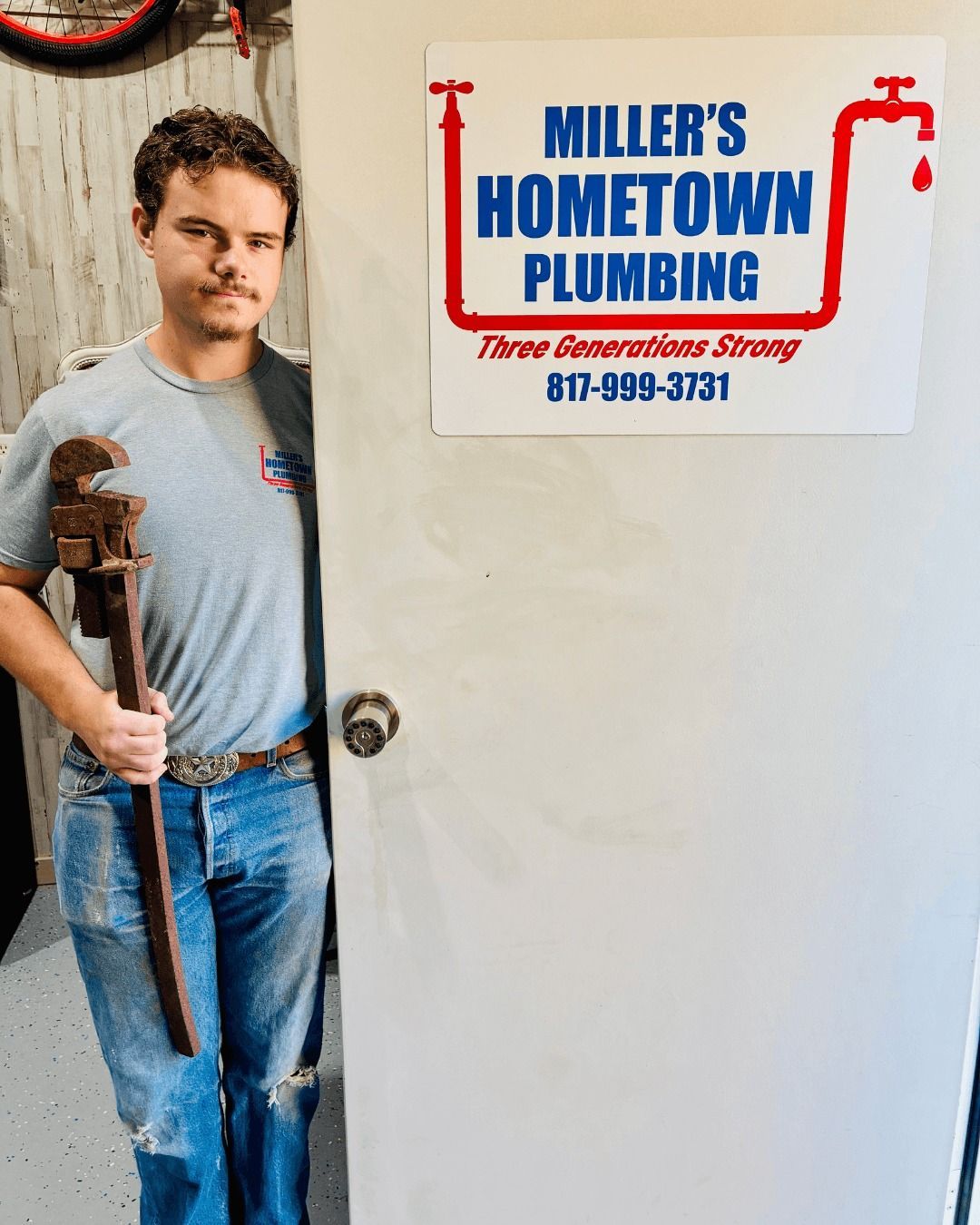 Man holding wrench, standing by 