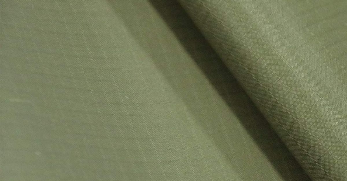 A close up of a piece of green fabric on a table.
