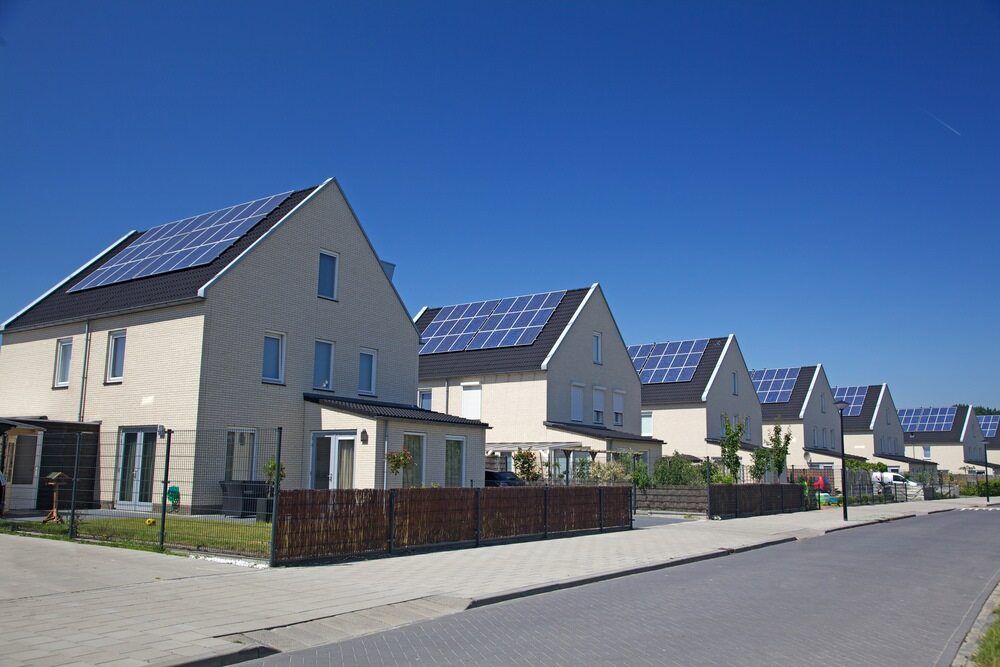 Row of Houses With Solar Panels on Their Roofs — Mid Richmond Plumbers & Suppliers in Coraki, NSW
