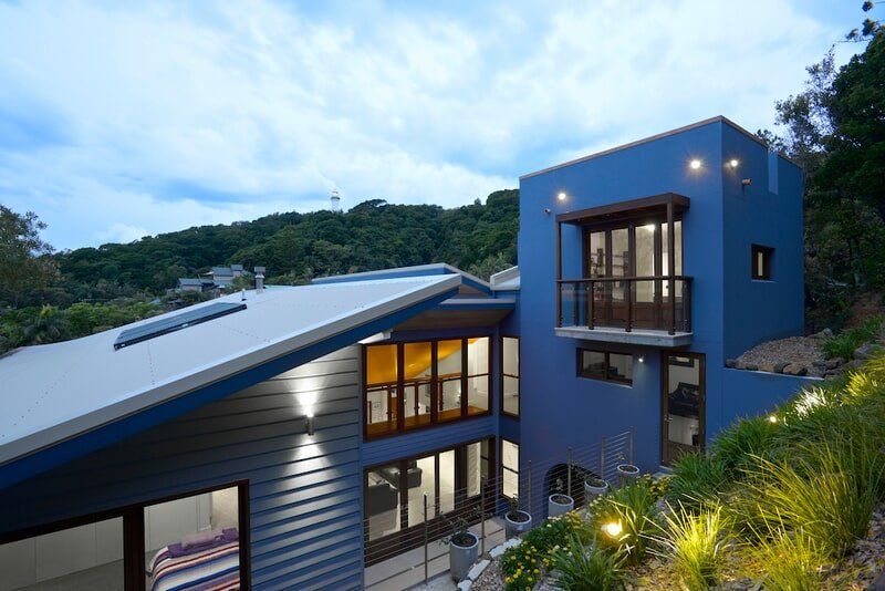 A Large Blue House is Sitting on Top of a Hill — Mid Richmond Plumbers & Suppliers in Coraki, NSW