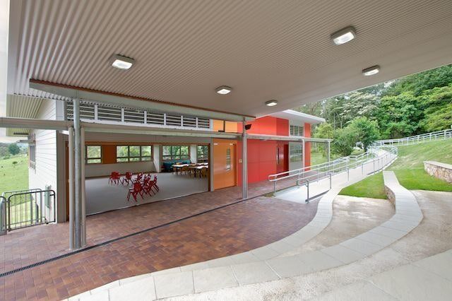 A Large Building With a Ramp Leading to It — Mid Richmond Plumbers & Suppliers in Coraki, NSW