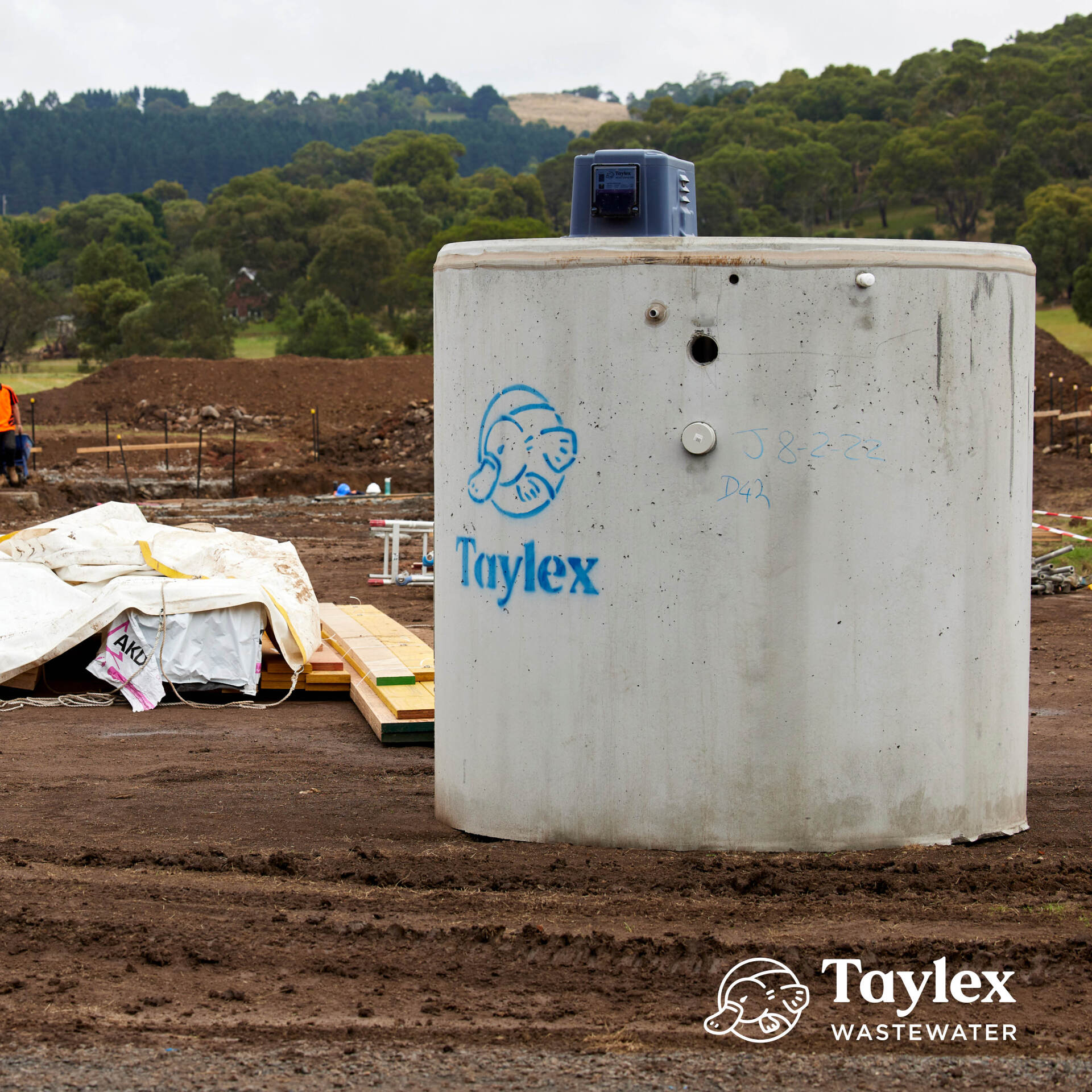 A Large Concrete Cylinder With the Word Taylex on It — Mid Richmond Plumbers & Suppliers in Coraki, NSW