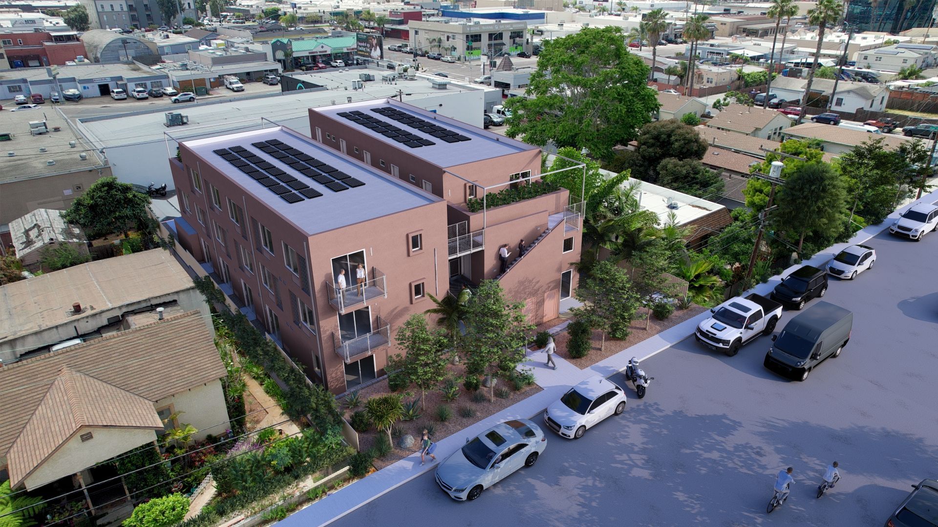An aerial view of a building with solar panels on the roof