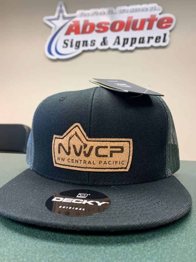 A black hat that says nwcp on it
