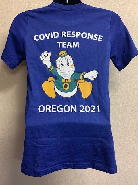 A blue shirt that says covid response team oregon 2021