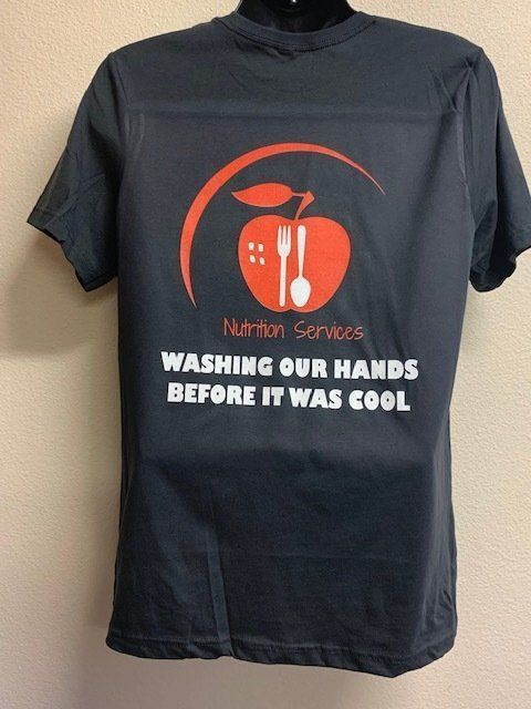 A t-shirt that says nutrition services washing our hands before it was cool