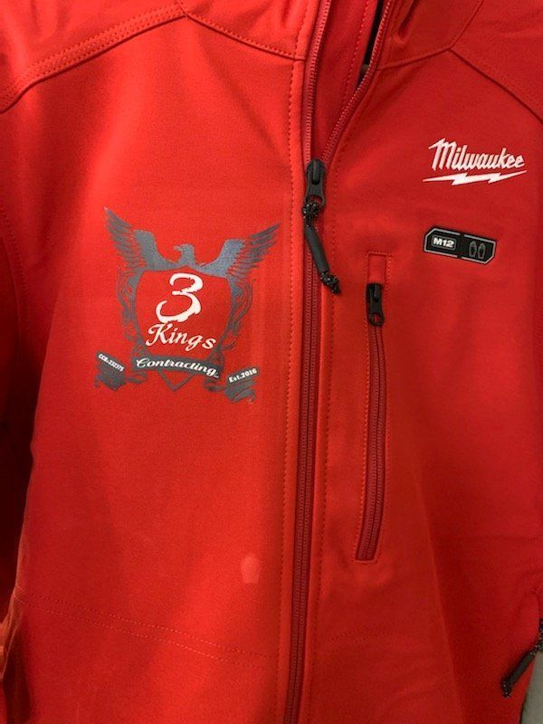A red jacket with the word milwaukee on it