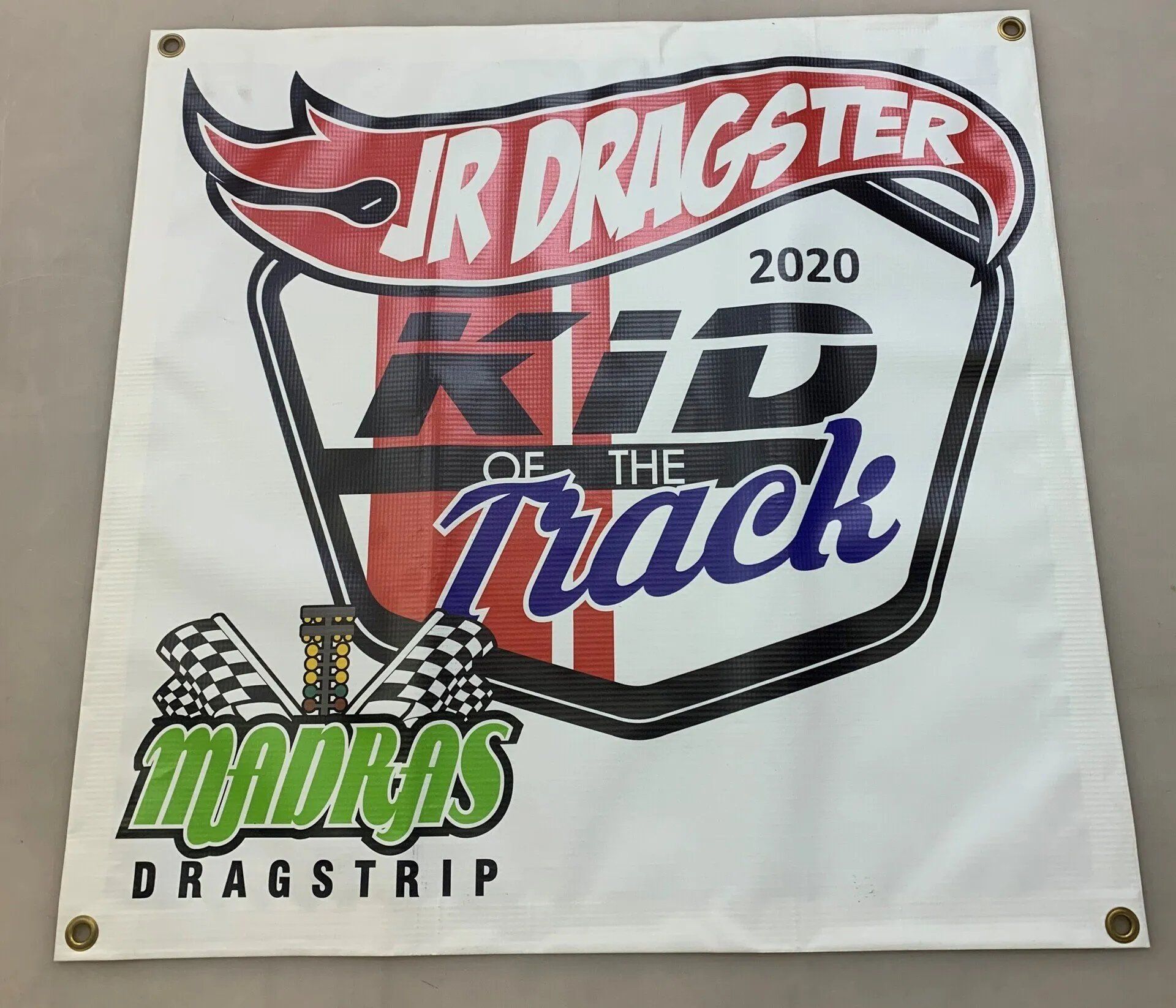 A sign that says jr dragster kid of the track