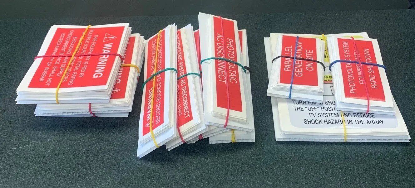 A bunch of red and white cards with the word caution on them