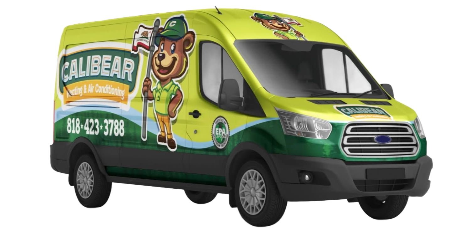 Gray air conditioning unit outside a building with electrical box.