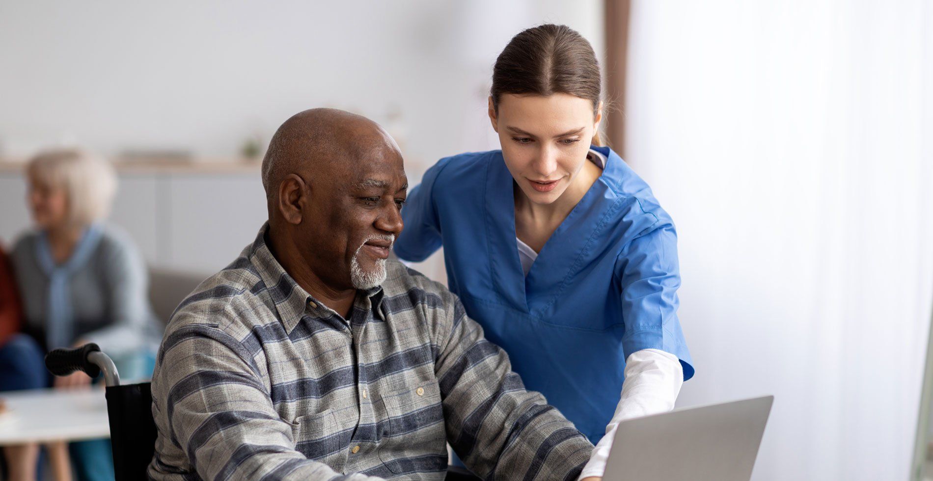 Nurse Teaching Old Man To Use Laptop - Saint Louis, MO - Mediplex Community Hospice