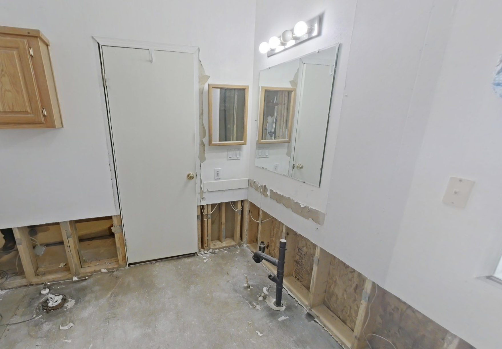 Bathroom water damage showing extent of flooding