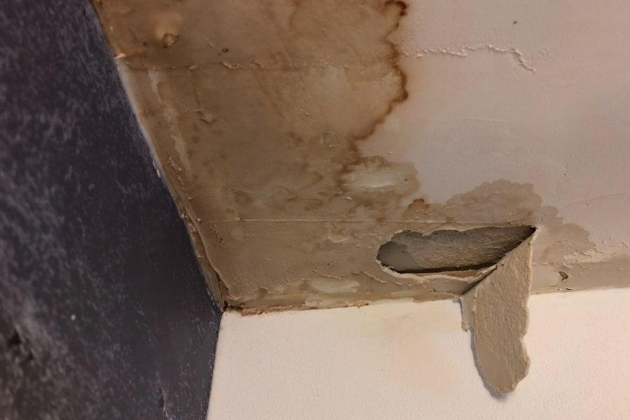 Ceiling water damage from wind-damaged roof