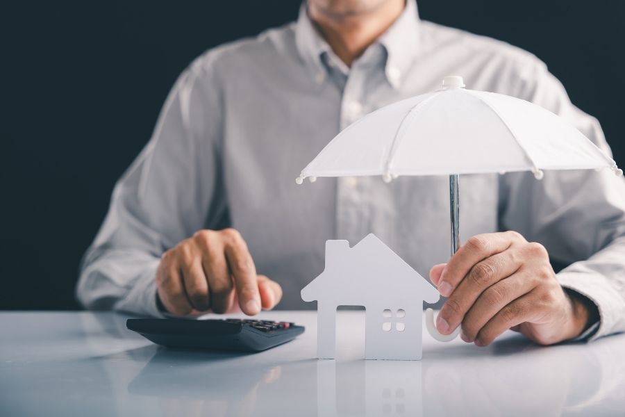 Homeowner reviewing insurance coverage documents for water damage