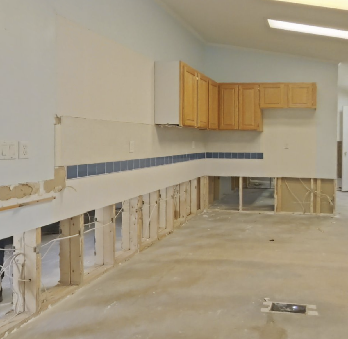 Kitchen water damage with removed flooring