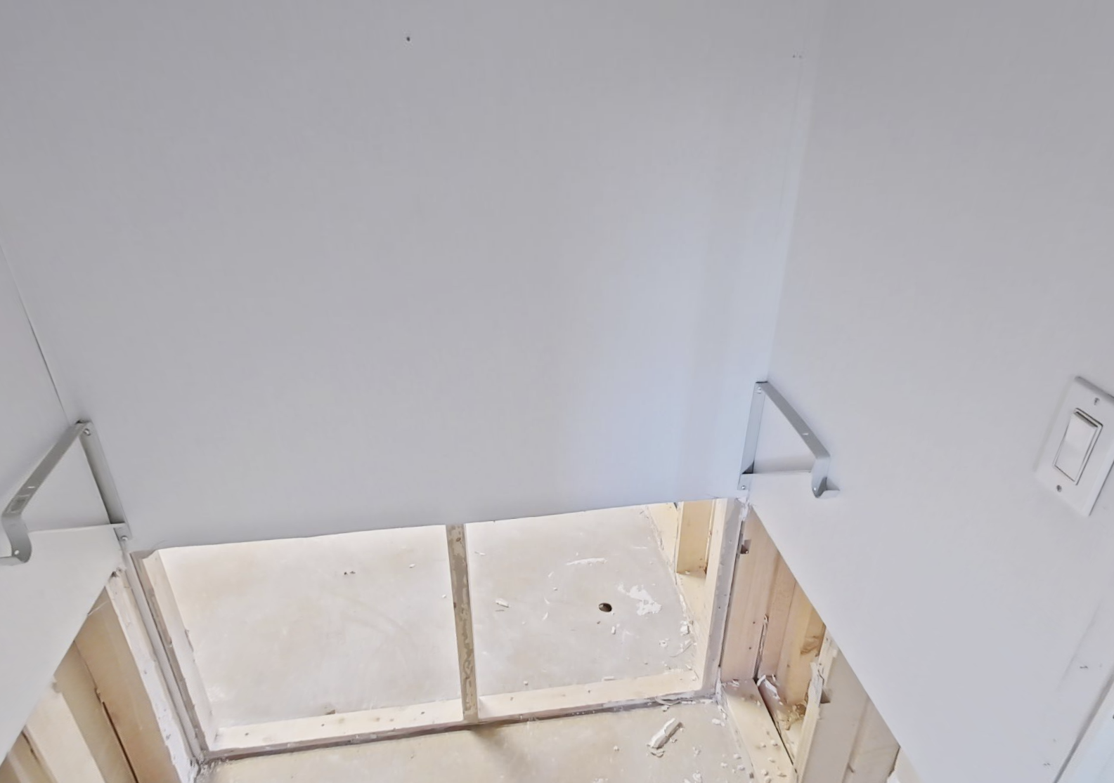 Laundry room demo showing water damage extent