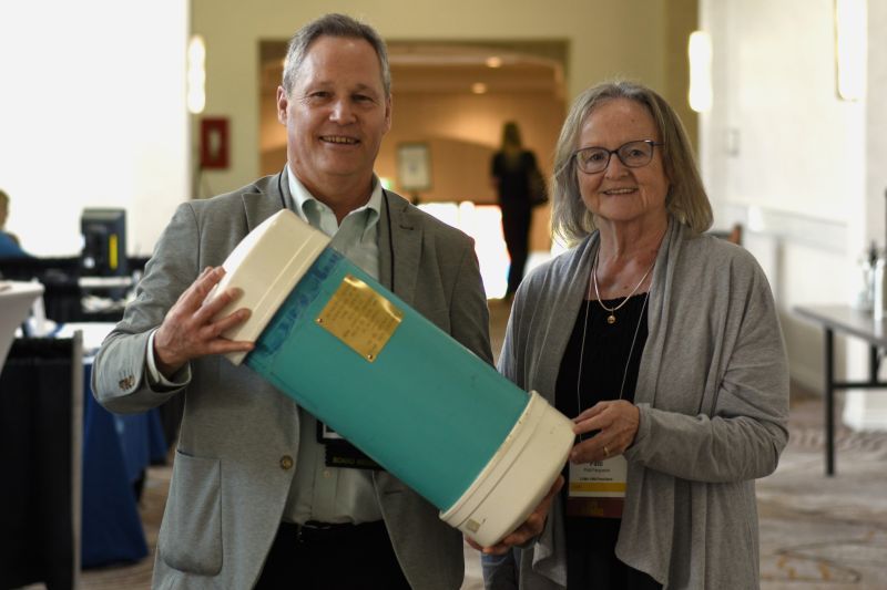 Douglas Holmes and Patti Ferguson with the LGMA time capsule at 2025 Conference