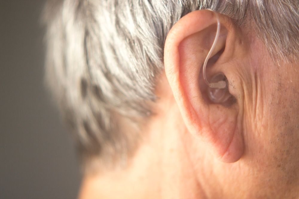 A Close Up of an Elderly Woman's Ear With a Hearing Aid — Clayton Hearing in Pialba, QLD