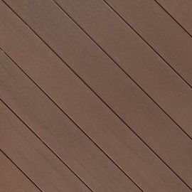 A close up of a wooden deck with diagonal lines.