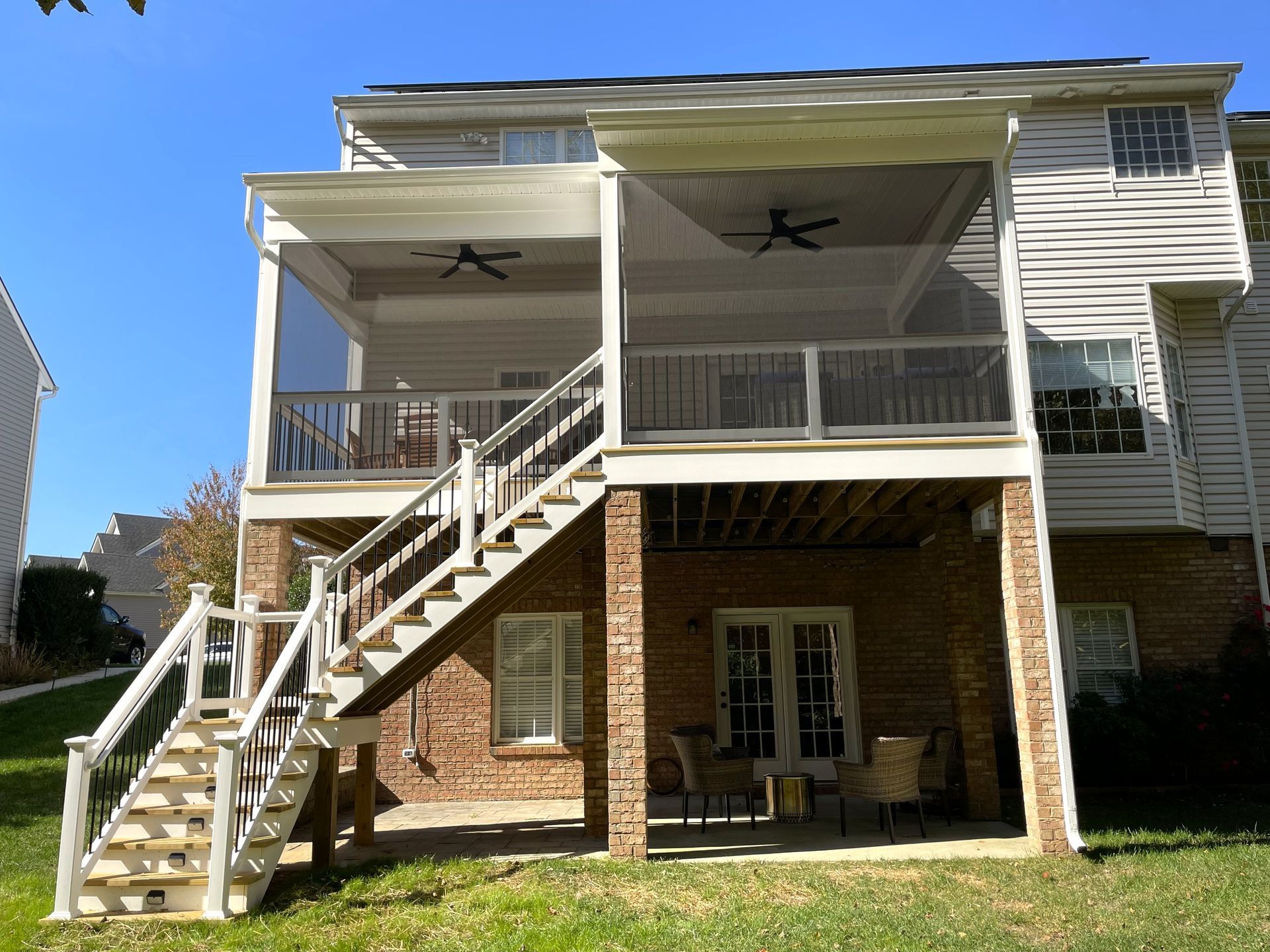The back of a house with a deck and stairs