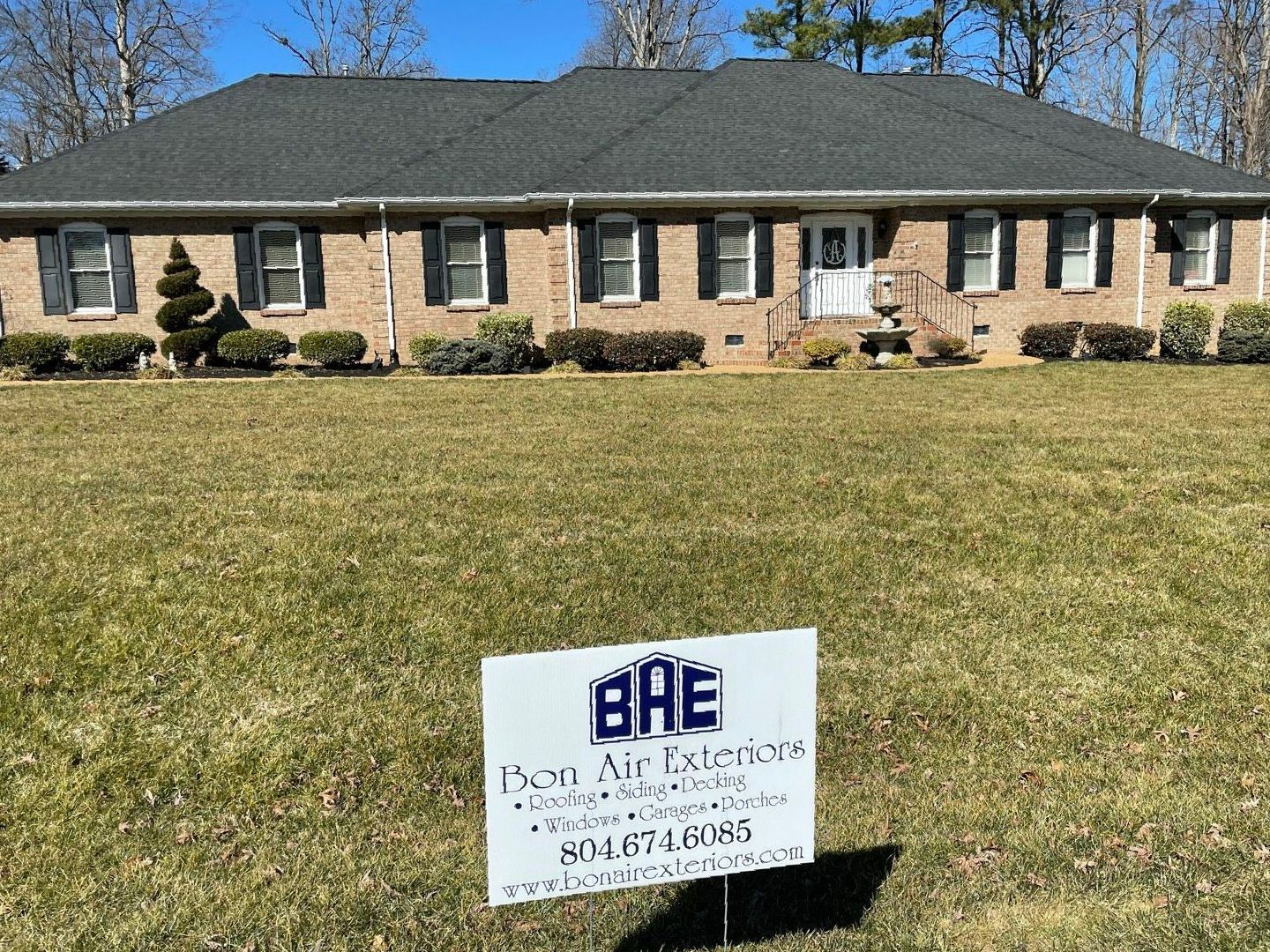 A house with a sign in front of it that says `` bae ''.