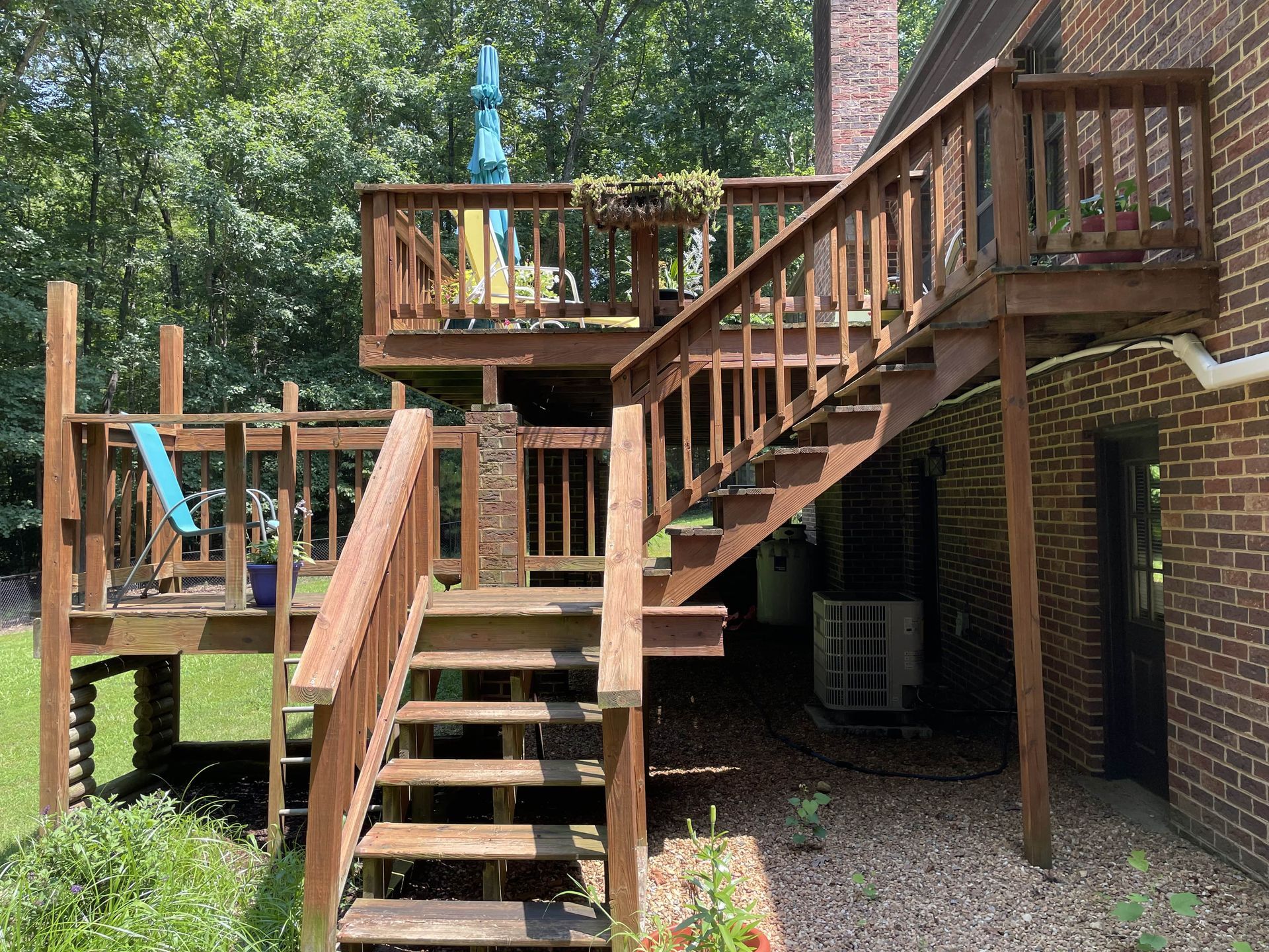 A wooden deck with stairs leading up to it