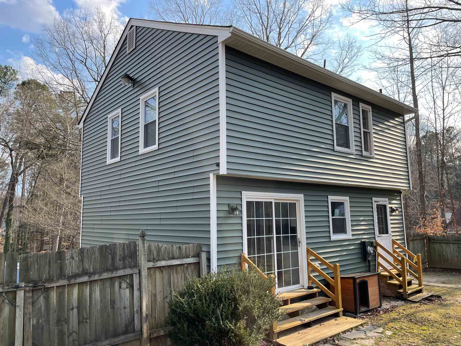 Back of a House with a Wooden Fence in Powhatan | Richmond, VA | Bon Air Exteriors