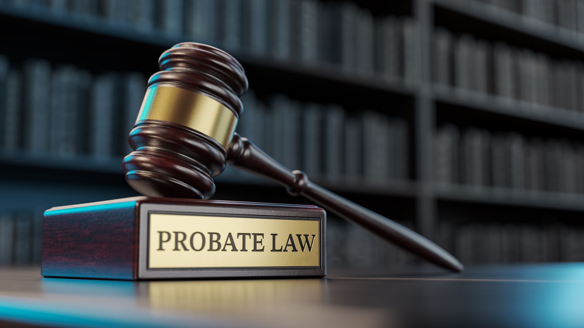 A judge 's gavel is sitting on top of a book titled probate law.