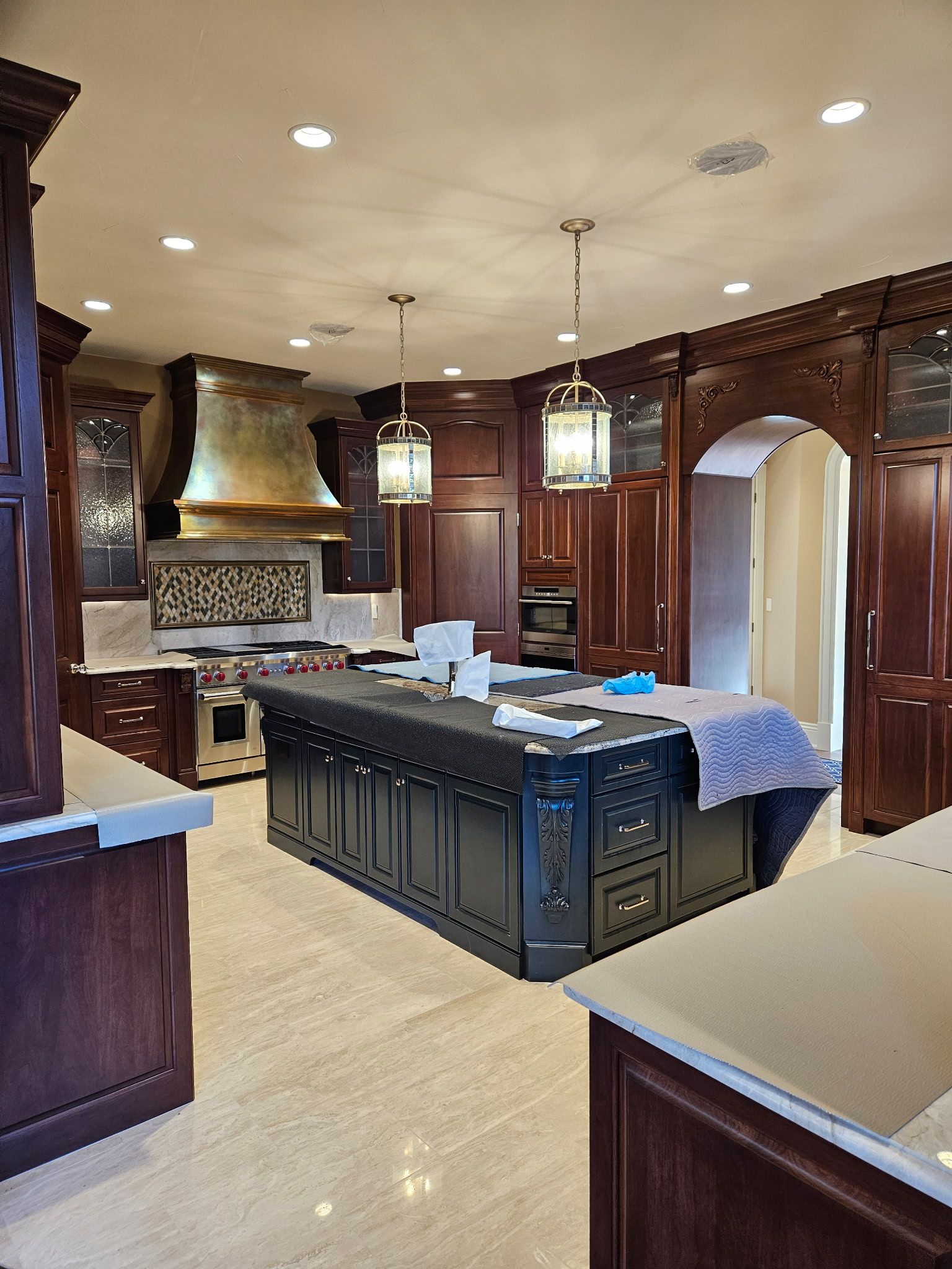 A kitchen with a large island in the middle of it.