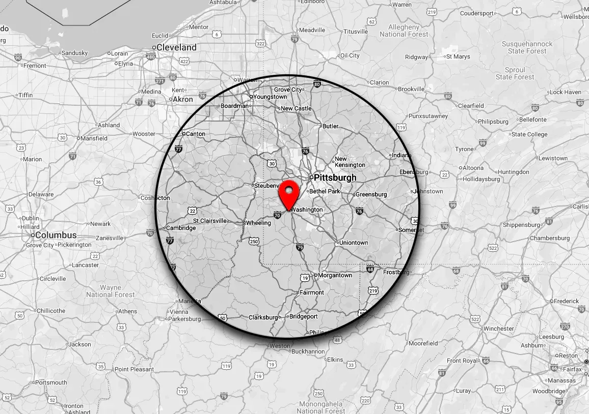 Map with a red pin in the center surrounded by a black circle. The area around the pin is detailed.