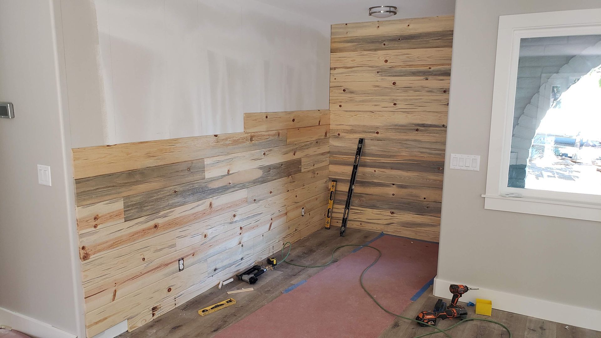 a kitchen under construction with a large island in the middle of the room .