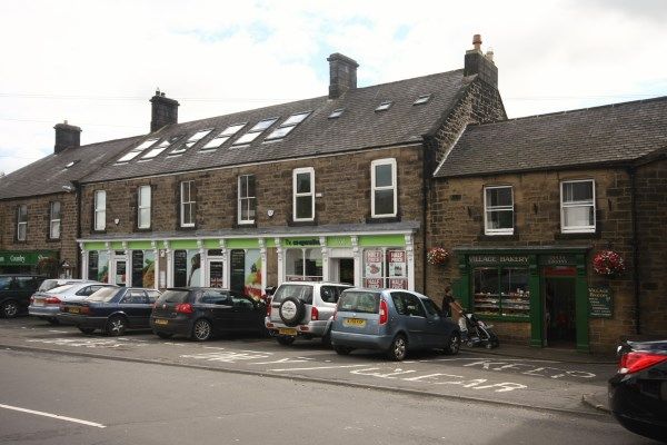 Row of Bellinghams stone shopfronts 